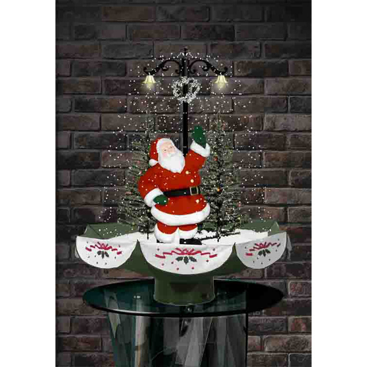 The Holiday Aisle® 29" Musical Snowing Christmas Tree, Santa Family Scene With Green Umbrella